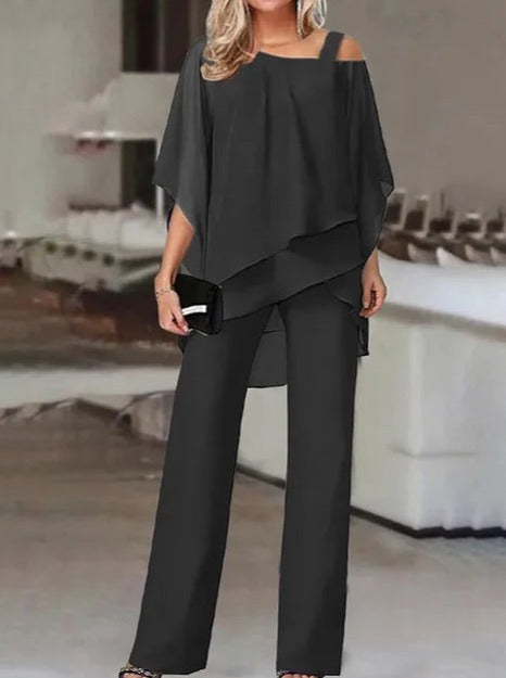 Luxuriöses, asymmetrisches Set aus schulterfreier Bluse und Hose 