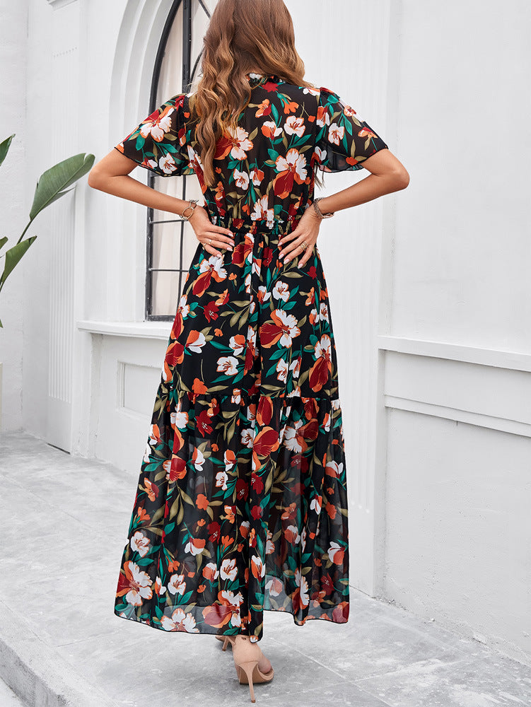 Schwarz-grünes Sommerkleid mit V-Ausschnitt und Blumenmuster 