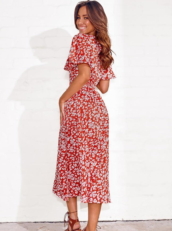 Kleid mit tiefem V-Ausschnitt, kurzen Ärmeln, Blumendruck und Schlitz