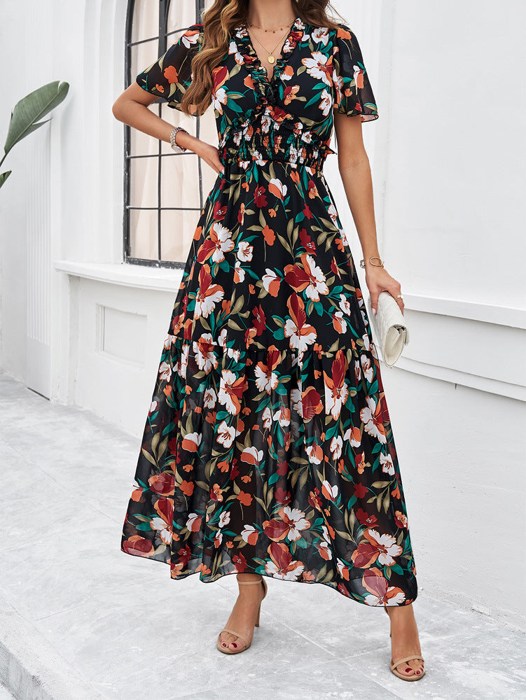 Schwarz-grünes Sommerkleid mit V-Ausschnitt und Blumenmuster 