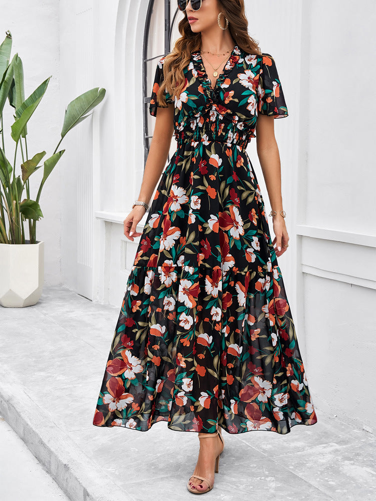 Schwarz-grünes Sommerkleid mit V-Ausschnitt und Blumenmuster 