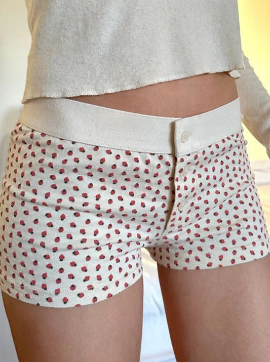 Pantaloncini con bottoni stampati con fragole bianche 