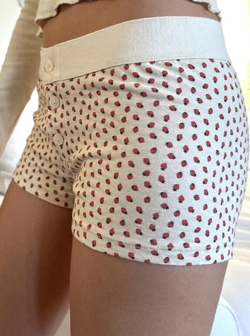 Weiße Shorts mit Knopfleiste und Erdbeer-Print 